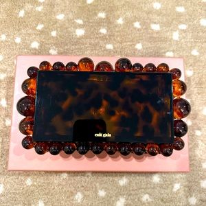 Cult Gaia Eos Clutch in tortoise.